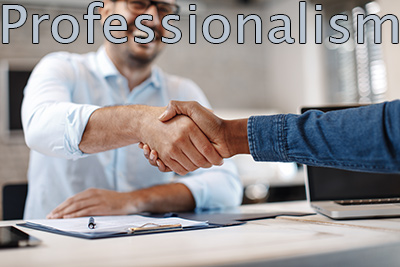 ITM company in NJ supports professional relationships, two business people shaking hands, one wearing white button down shirt, other wearing denim shirt.